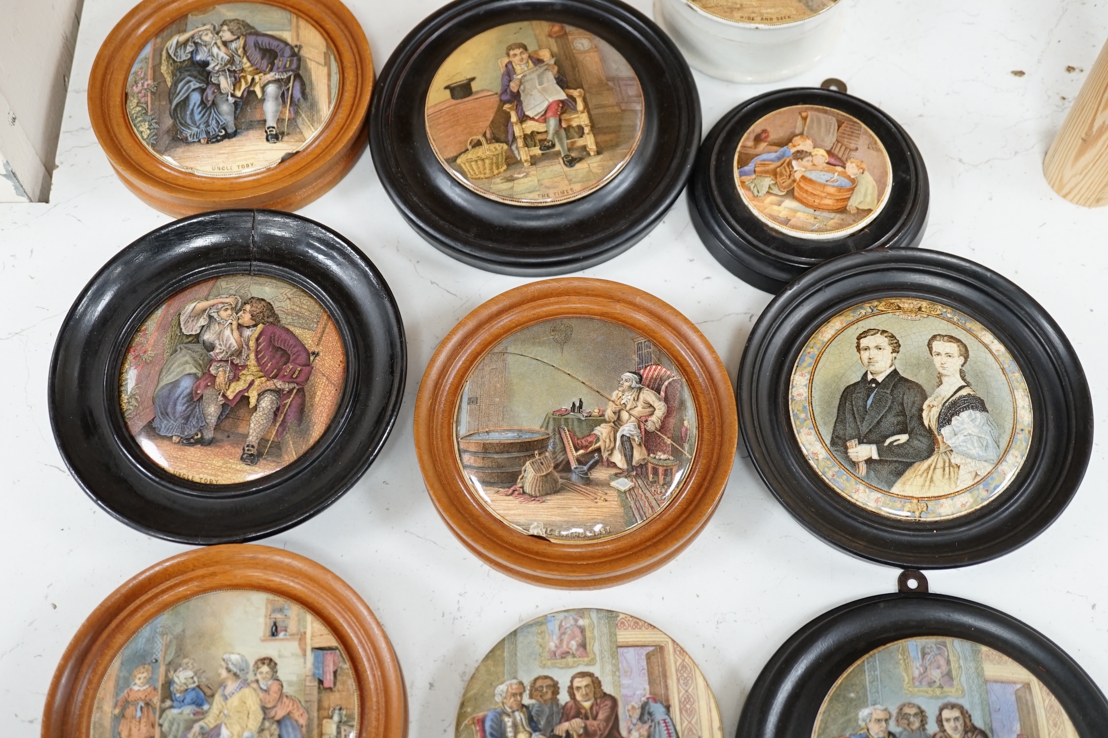 Nine 19th century framed pot lids including ‘Hide and Seek’ and ‘Uncle Toby’ and a jar and cover, largest overall 16cm diameter. Condition - fair to good